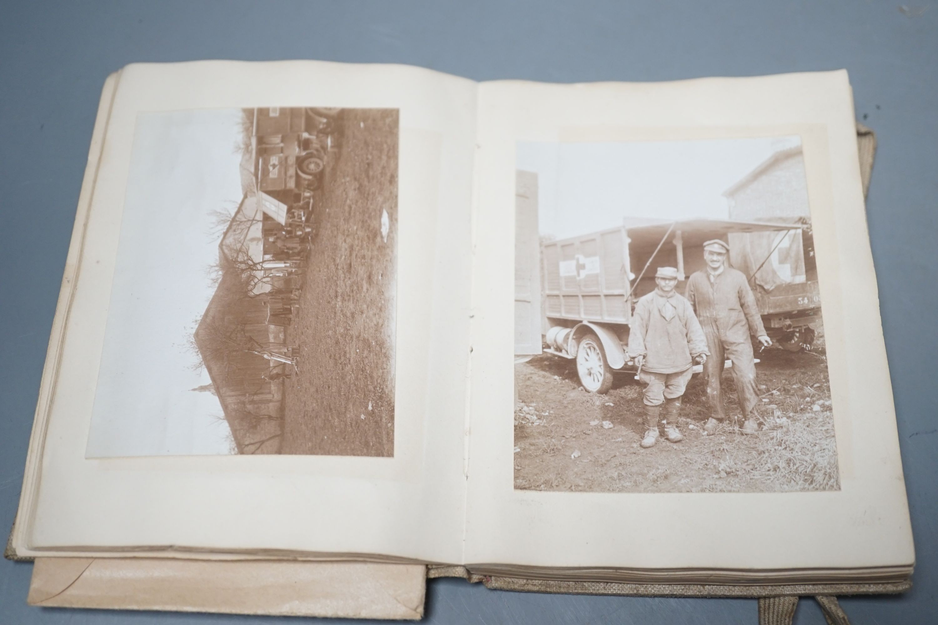 A WWI Ambulance and Balloon Brigade photograph album, pocket watch, coin, etc.